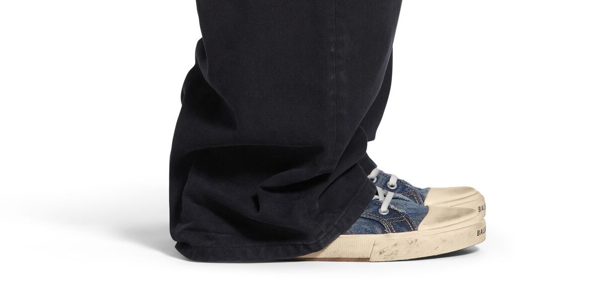 Balenciaga Sneakers pair of charcoal slacks with a powder